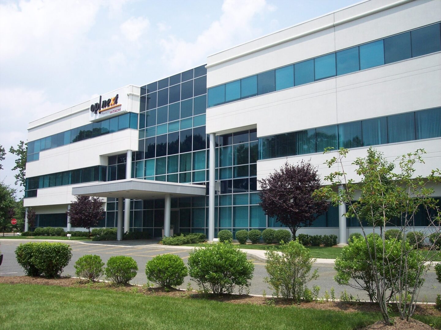 A large building with many windows and trees