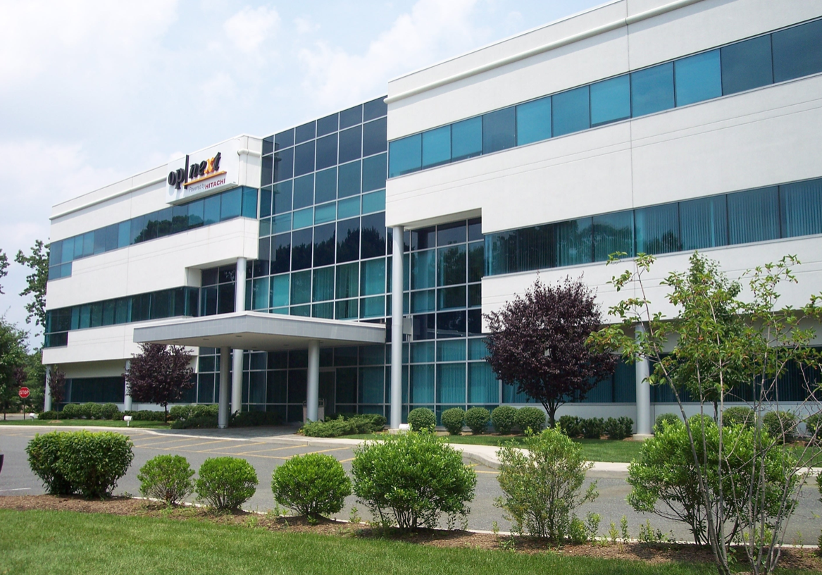 A large building with many windows and trees