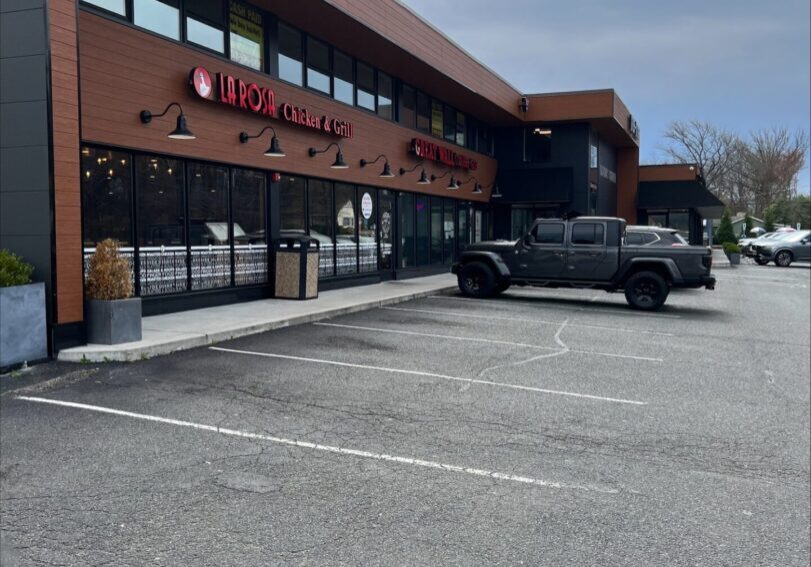 A truck parked in front of a building.